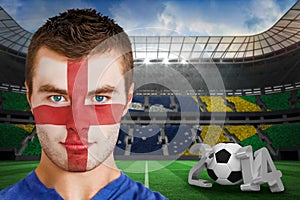 Composite image of serious young england fan with facepaint