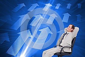 Composite image of side view of businessman in his chair