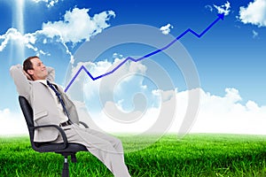 Composite image of side view of businessman leaning back in his chair