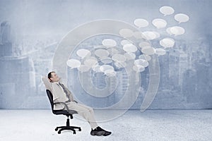 Composite image of side view of businessman leaning back in his chair