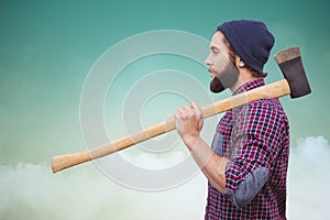 Composite image of side view of hipster with axe on shoulder