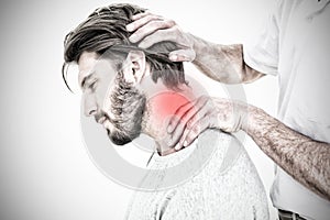 Composite image of side view of a man getting the neck adjustment done photo