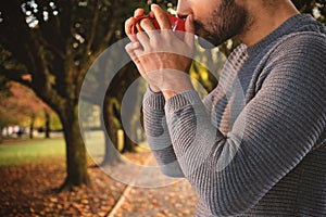 Composite image of side view of thoughtful man having coffee