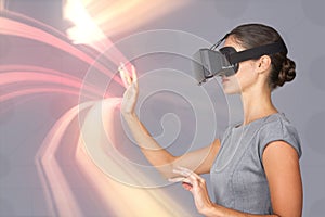 Composite image of side view of young woman gesturing while using virtual video glasses