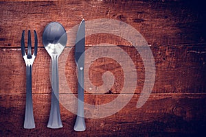 Composite image of silver knife, fork and spoon