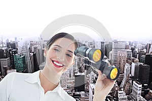 Composite image of smiling business woman with binoculars