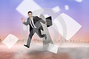 Composite image of smiling businessman in a hurry