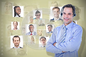 Composite image of smiling businessman using headset