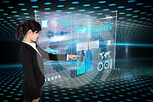 Composite image of smiling businesswoman pointing