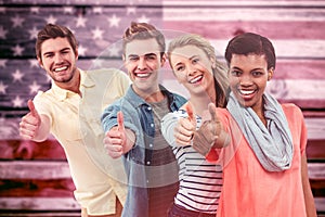 Composite image of smiling creative team standing in a line