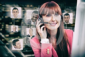 Composite image of smiling hipster businesswoman using headset