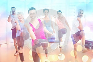 Composite image of smiling people doing power fitness exercise at yoga class