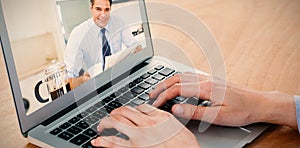 Composite image of smiling well dressed man with coffee cup and newspaper in kitchen