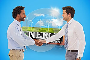 Composite image of smiling young businessmen shaking hands in office