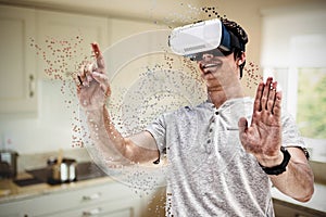 Composite image of smiling young man using virtual reality glasses