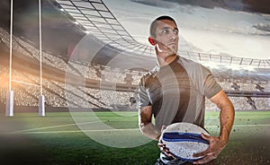 Composite image of sober rugby player holding ball