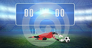 Composite image of soccer goalkeeper and ball and digital score