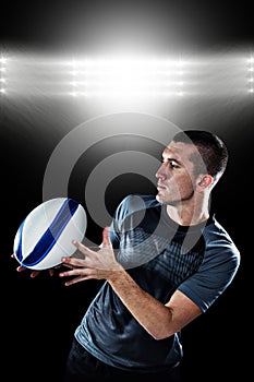 Composite image of sports player catching the ball