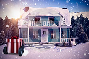 Composite image of striped red and white gift box on wheels