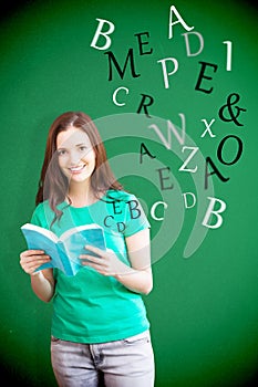 Composite image of student picking a book from shelf in library