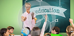 Composite image of students raising hands while teacher teaching