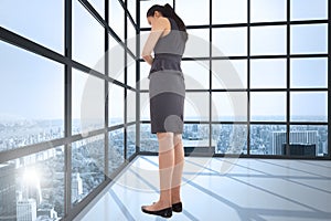 Composite image of thinking asian businesswoman