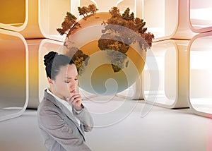 Composite image of thinking asian businesswoman pointing