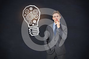 Composite image of thinking businessman
