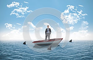 Composite image of thinking businessman in a sailboat