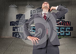 Composite image of thinking businessman scratching head