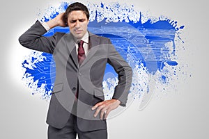 Composite image of thinking businessman scratching head