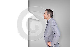 Composite image of thinking businessman with speech bubble