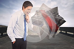 Composite image of thinking businessman touching his chin