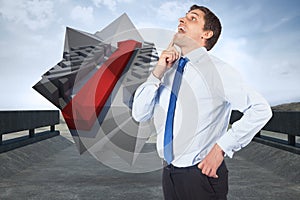 Composite image of thinking businessman touching his chin