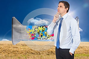 Composite image of thinking businessman touching his chin