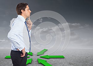 Composite image of thinking businessman touching his chin