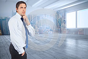 Composite image of thinking businessman touching his chin