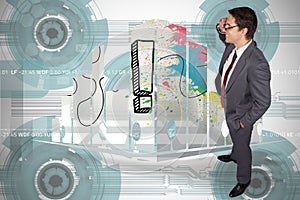 Composite image of thinking businessman touching his glasses