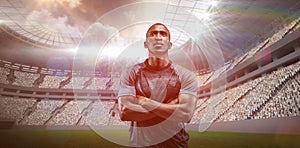 Composite image of thoughtful athlete standing with arms crossed 3D