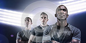 Composite image of thoughtful athlete standing with arms crossed