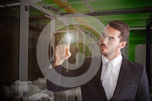 Composite image of thoughtful businessman pointing something with his finger