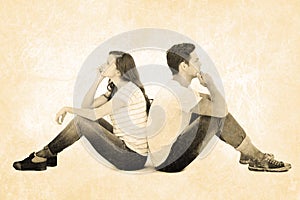 Composite image of thoughtful couple sitting on floor back to back