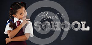 Composite image of thoughtful schoolgirl over white background