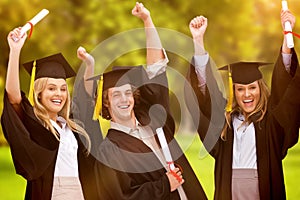 Composite image of three students in graduate robe raising their arms