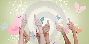 Composite image of thumbs raised and hands up