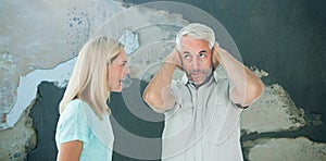 Composite image of unhappy couple having an argument with man not listening