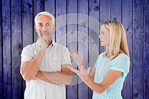 Composite image of unhappy couple having an argument with man not listening