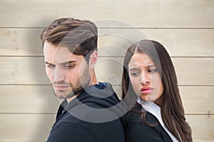 Composite image of unhappy couple not speaking to each other