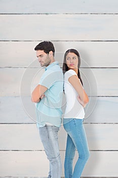 Composite image of unhappy couple not speaking to each other