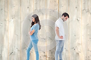 Composite image of upset couple not talking to each other after fight